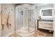 Modern bathroom featuring a deluxe shower with glass doors and vanity with large sink at 4121 S Allison St, Denver, CO 80235