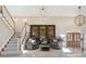 Bright, open foyer featuring large bookshelves and chandelier at 4121 S Allison St, Denver, CO 80235