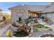 Charming exterior with a stone pathway and water feature at 4121 S Allison St, Denver, CO 80235