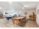 Finished basement game room featuring a pool table and ping pong table for entertaining at 4121 S Allison St, Denver, CO 80235