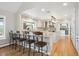 This spacious kitchen features an island with barstool seating, granite countertops, and stainless steel appliances at 4121 S Allison St, Denver, CO 80235
