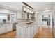 Gourmet kitchen with granite countertops, stainless steel appliances, and large island at 4121 S Allison St, Denver, CO 80235