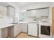 Efficient laundry room features modern appliances and ample storage for convenience at 4121 S Allison St, Denver, CO 80235