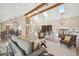 Open living room with high ceilings, wood beams, and lots of natural light at 4121 S Allison St, Denver, CO 80235