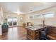 Office with hardwood floors, custom desk, and sliding glass door to outdoor patio at 4121 S Allison St, Denver, CO 80235