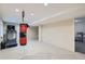 Finished basement featuring carpeted flooring, recessed lighting, punching bag, and treadmill at 912 S Galena St, Aurora, CO 80247