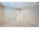 Unfinished basement featuring plush carpet and an access door at 912 S Galena St, Aurora, CO 80247