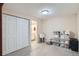 Unfinished basement features a laundry sink, storage area, and access to a bathroom at 912 S Galena St, Aurora, CO 80247