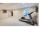 Finished basement featuring carpeted flooring, recessed lighting, punching bag, and treadmill at 912 S Galena St, Aurora, CO 80247