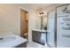 Well-lit bathroom features double vanities, walk-in shower, and ample counter space at 912 S Galena St, Aurora, CO 80247