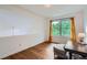 Cozy bedroom with hardwood floors, natural light, and a charming lamp at 912 S Galena St, Aurora, CO 80247