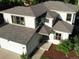 Aerial view of a two-story home showcasing its architectural details, attached garage, and manicured landscaping at 912 S Galena St, Aurora, CO 80247