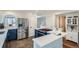 Modern kitchen with stainless steel appliances, white cabinets, and stylish blue accents at 912 S Galena St, Aurora, CO 80247