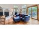 Comfortable living room with a fireplace, large windows, and a sliding door to the patio at 912 S Galena St, Aurora, CO 80247