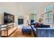 Living room features a fireplace, large windows and an open layout to the kitchen at 912 S Galena St, Aurora, CO 80247