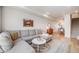 Open concept living room flowing into dining area and featuring hardwood floors at 3520 W Conejos Pl # 10, Denver, CO 80204