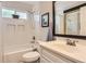 Bright bathroom with shower-tub combo and classic fixtures at 8432 S Upham Way, Littleton, CO 80128