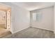 Bedroom with neutral walls, carpet, and a window with blinds at 8432 S Upham Way, Littleton, CO 80128