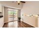 Bright dining area with sliding glass doors to deck and ceiling fan at 8432 S Upham Way, Littleton, CO 80128
