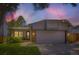Charming home with well-maintained lawn and attached garage at 8432 S Upham Way, Littleton, CO 80128