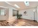 Inviting living area with hardwood floors and ample natural light at 8432 S Upham Way, Littleton, CO 80128