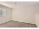 Room featuring neutral walls, carpet, and a window with blinds at 8432 S Upham Way, Littleton, CO 80128