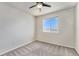 Minimalist bedroom featuring a large window offering ample natural light at 1631 Aspen Meadows Cir, Denver, CO 80260
