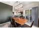 Open dining area seamlessly connected to the living room, featuring a view of the patio at 1631 Aspen Meadows Cir, Denver, CO 80260