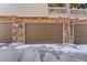 Exterior view of attached garages at 1631 Aspen Meadows Cir, Denver, CO 80260