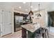 Well-equipped kitchen featuring stainless steel appliances, a center island, and plenty of cabinet space at 1631 Aspen Meadows Cir, Denver, CO 80260