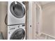 Convenient laundry area with stacked washer and dryer units at 1631 Aspen Meadows Cir, Denver, CO 80260