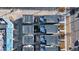 Aerial view showcasing modern urban homes with rooftop patios, parking, and landscaping at 2625 W 23Rd Ave, Denver, CO 80211