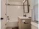Well-lit bathroom with modern vanity, black hardware, and shower-tub combination at 2625 W 23Rd Ave, Denver, CO 80211