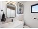 Clean, contemporary bathroom with a single vanity, minimalist fixtures, and artistic wall decor at 2625 W 23Rd Ave, Denver, CO 80211