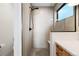 Modern shower features sleek fixtures, a glass enclosure, and neutral tile at 2625 W 23Rd Ave, Denver, CO 80211