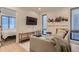 Cozy bedroom featuring a comfortable seating area and a view to the next room at 2625 W 23Rd Ave, Denver, CO 80211