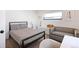 Cozy bedroom with a platform bed, stylish linen, couch, natural light, and modern decor at 2625 W 23Rd Ave, Denver, CO 80211