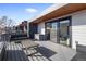 Outdoor deck with modern furnishings, wood ceiling, privacy walls, and a sunny view at 2625 W 23Rd Ave, Denver, CO 80211
