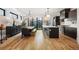 Open-concept kitchen and dining area with stainless steel appliances and access to the backyard at 2625 W 23Rd Ave, Denver, CO 80211