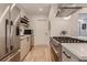 Modern kitchen featuring stainless steel appliances and a professional-grade gas range at 2625 W 23Rd Ave, Denver, CO 80211