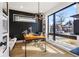 Home office with large window and modern black and wood accents with street views at 2625 W 23Rd Ave, Denver, CO 80211