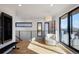 Bright sitting area with a comfy chair, natural light, and modern railings overlooking a staircase at 2625 W 23Rd Ave, Denver, CO 80211