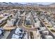 Scenic aerial view of the residential neighborhood with mountain backdrop, showcasing community layout at 11487 W Grand Way, Littleton, CO 80127