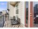 Cozy outdoor balcony offering fresh air, seating, and a view of the neighborhood at 11487 W Grand Way, Littleton, CO 80127