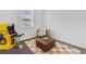 Eclectic bonus room with gaming setup, cozy seating area, and playful decor for entertainment and relaxation at 11487 W Grand Way, Littleton, CO 80127