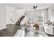 Open living room showcases a staircase and an abundance of natural light at 11487 W Grand Way, Littleton, CO 80127