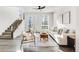 Bright living room with modern furnishings, stylish decor, and sun-drenched windows at 11487 W Grand Way, Littleton, CO 80127