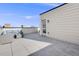 Relaxing rooftop patio with stylish outdoor seating and scenic neighborhood views; perfect for entertaining at 11487 W Grand Way, Littleton, CO 80127