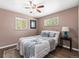 Cozy bedroom with neutral paint, ceiling fan and plush carpet throughout at 2695 S Logan St, Denver, CO 80210