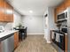 Bright kitchen features stainless steel appliances, wood cabinets and adjacent dining area at 2695 S Logan St, Denver, CO 80210